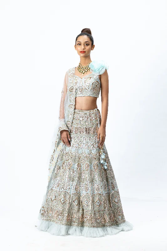 Powder Blue Hand-embroidered Lehenga paired with Hand-embroidered Blouse with 3D flower detailing and Hand- Embroidered Dupatta with buttis Modern Oversized Blouse Powder Blue Hand-embroidered Lehenga paired with Hand-embroidered Blouse with 3D flower detailing and Hand- Embroidered Dupatta with buttis Modern Oversized Blouse