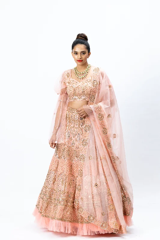 Dusty Pink Hand-embroidered Lehenga paired with Hand-embroidered Blouse with Elongated Sleeves and Hand-embroidered Dupatta with Buttis Ruched Sleeve Blouse Dusty Pink Hand-embroidered Lehenga paired with Hand-embroidered Blouse with Elongated Sleeves and Hand-embroidered Dupatta with Buttis Ruched Sleeve Blouse