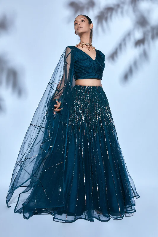 Teal Blouse paired with Teal Hand-embroidered Lehenga and Teal Hand-embroidered Dupatta Lightweight Linen Blouse Teal Blouse paired with Teal Hand-embroidered Lehenga and Teal Hand-embroidered Dupatta Lightweight Linen Blouse